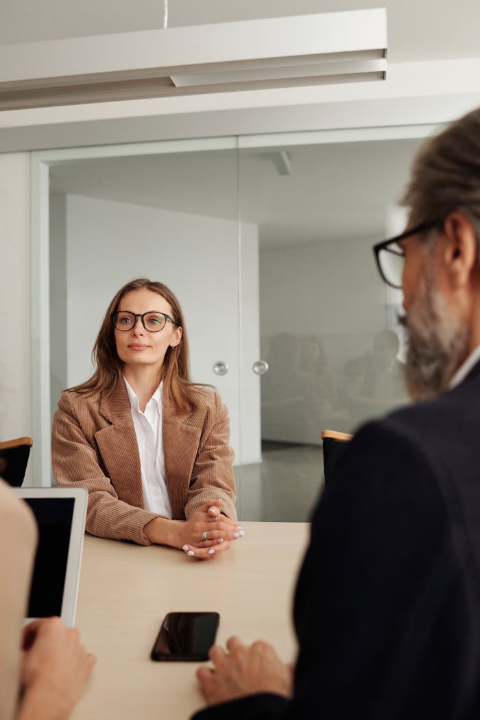 Services Business professionals engaged in a meeting in a modern office setting, focusing on collaboration and planning.